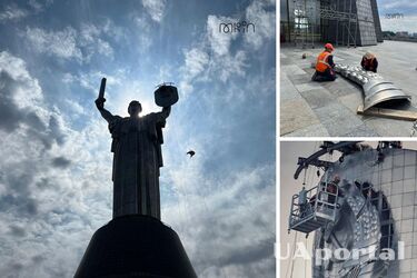 На монументе Родина-мать начали снимать советский герб для замены на украинский трезубец 