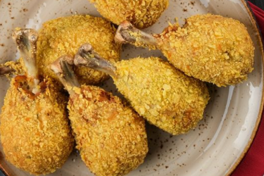 Breaded chicken drumsticks with deep fried potatoes