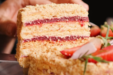 Delicious honey cake with cherry jam