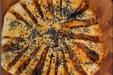 Lahmajun or Arabic 'pizza' - thin dough with minced meat on top